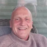 Man in his fifties walking outdoors